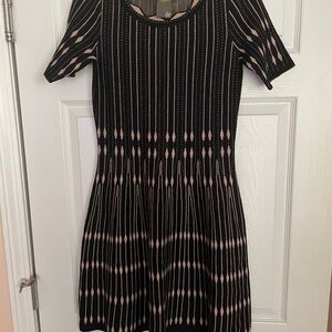 Tan and black dress rayon and polyester.